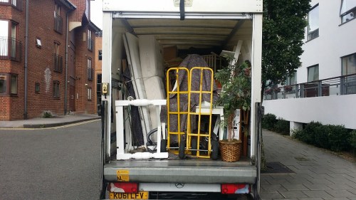 Staff preparing commercial waste containers for collection outside a Battersea business